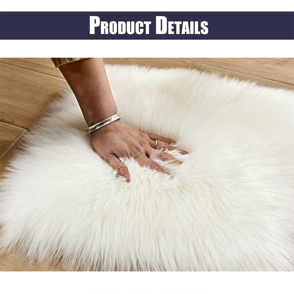 Hand touching Birino white faux sheepskin heart shaped rug, showing ultra-soft fluffy pile texture