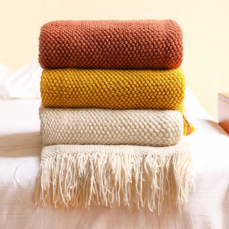 Anas pineapple grid knit throw blankets for couch stacked in multiple colors – Terracotta, Yellow and White with fringe
