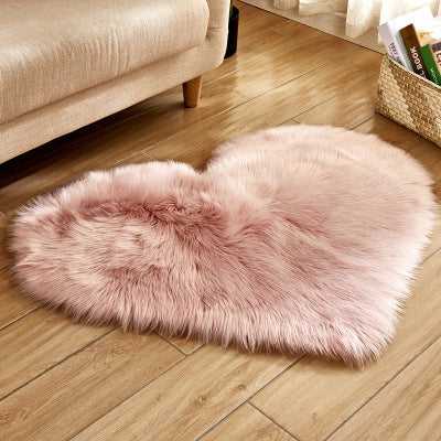 Birino faux sheepskin heart shaped rug in dusty pink, cute fluffy rug for bedroom or girls room