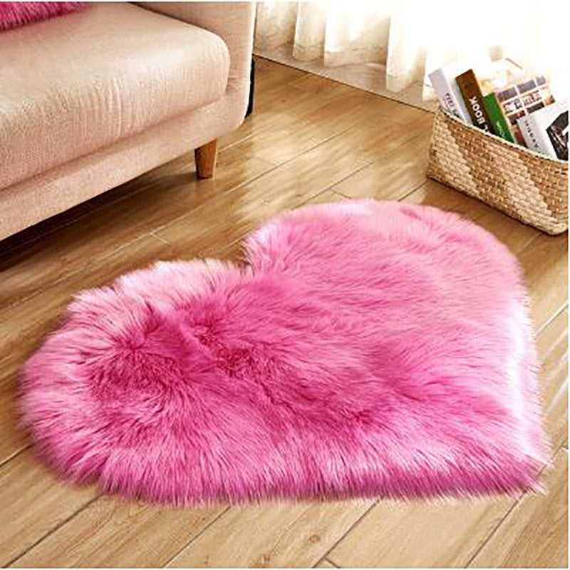 Birino faux sheepskin heart rug in hot pink, washable fluffy bedroom rug