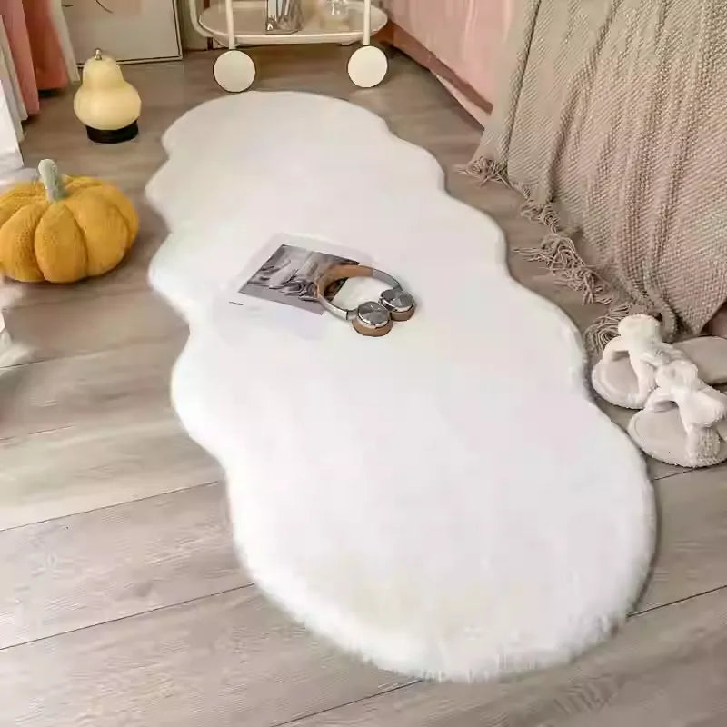 Pelo fluffy bedroom rug in White — soft irregular shape plush carpet beside bed