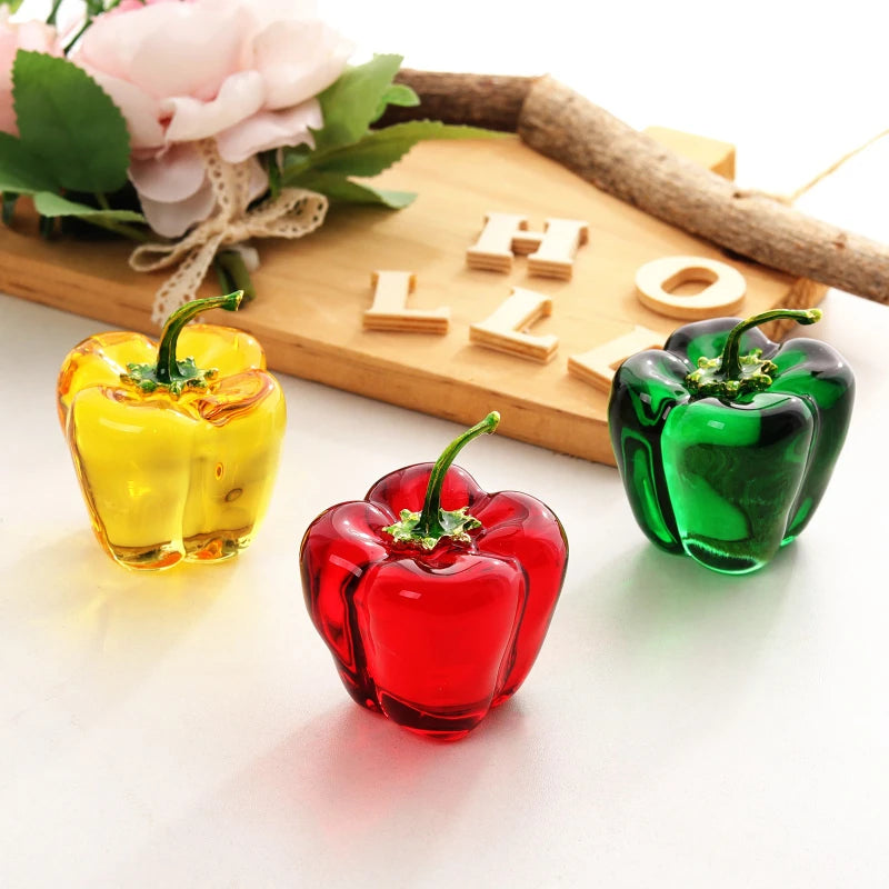 Close-up of handcrafted glass chili pepper showing colored glaze craftsmanship and glossy finish