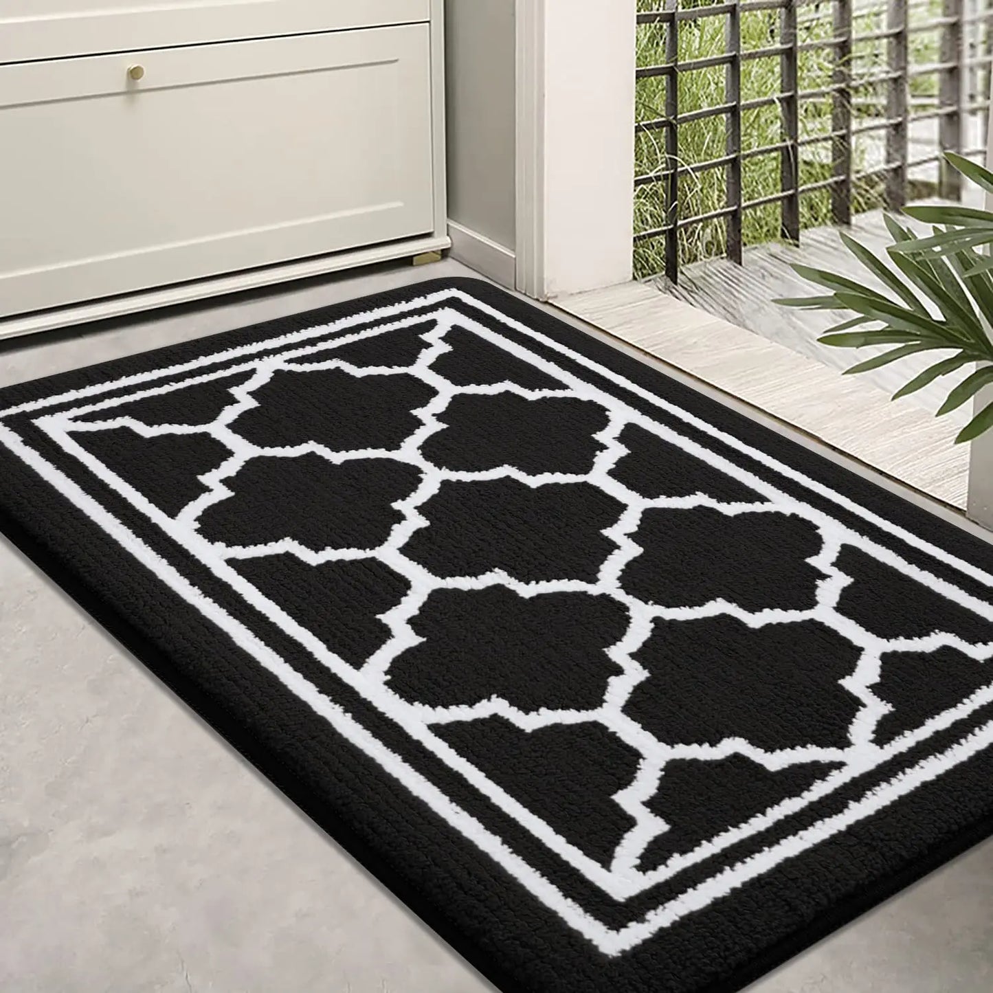Black Retika absorbent entrance rug in modern hallway interior