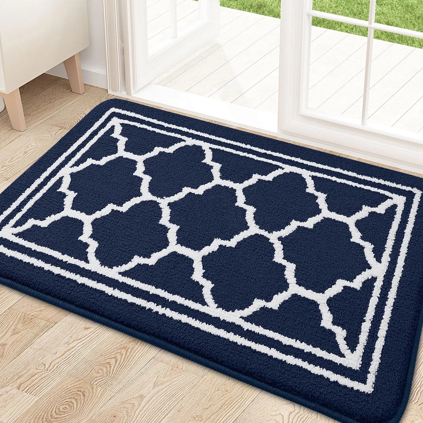 Retika non-slip door mat in navy blue placed at home entrance