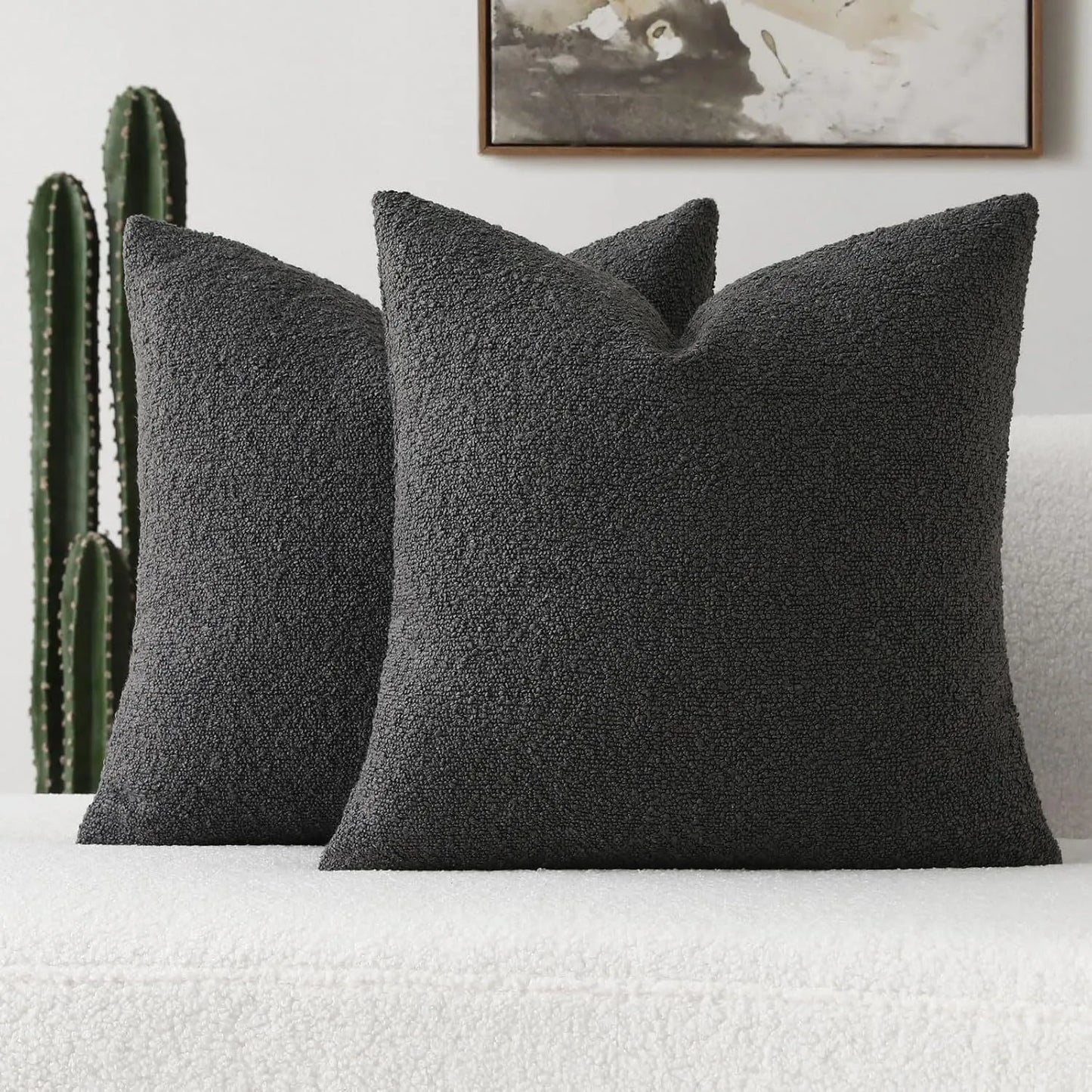 Xoco black teddy fleece pillow cover styled on modern sofa in contemporary living room